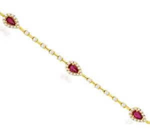 14k yellow gold pear shaped rubies and diamond station bracelet