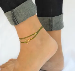 Handmade green dainty anklet with a gold anchor charm and gold beads