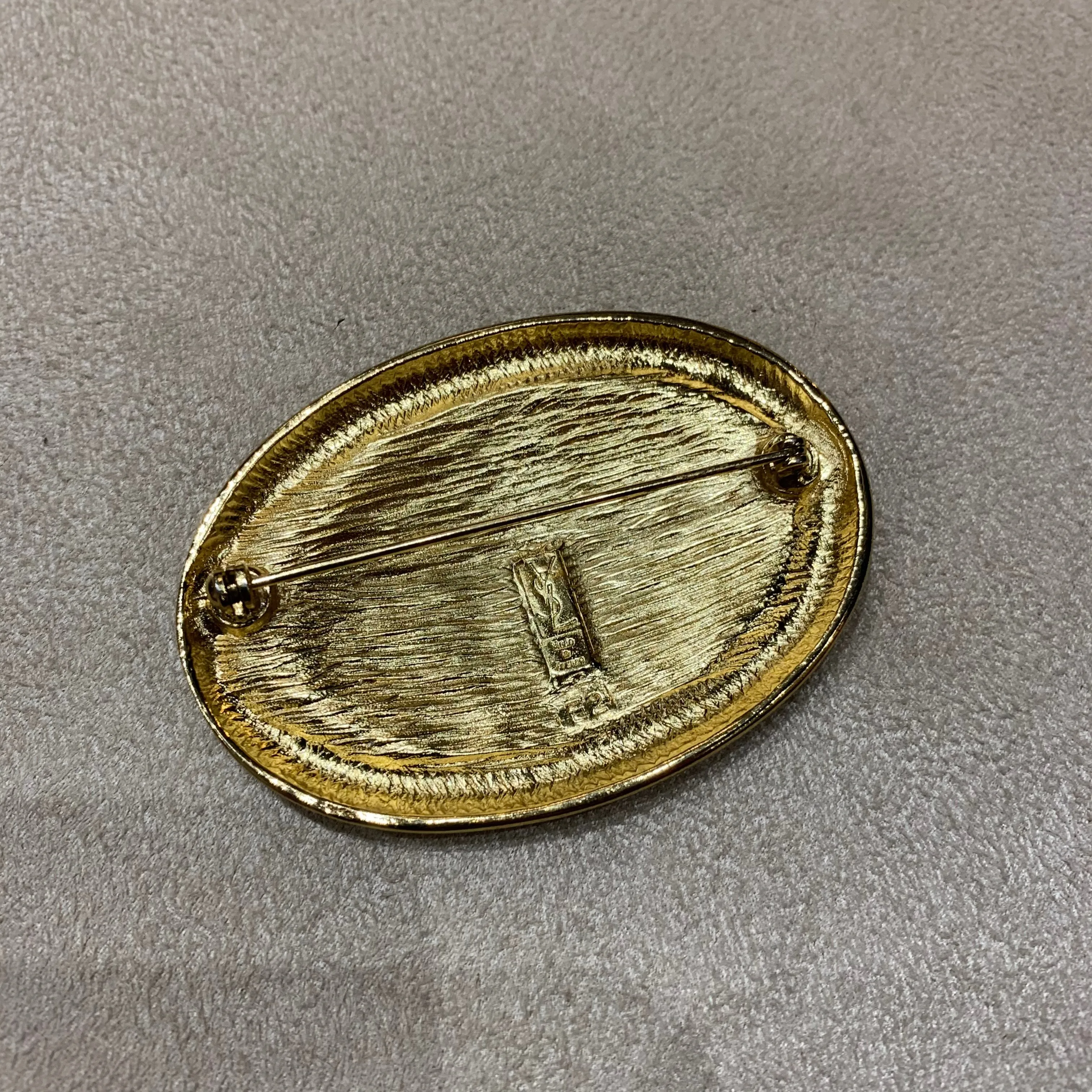 Yves Saint Laurent Gold Oval brooch YSL